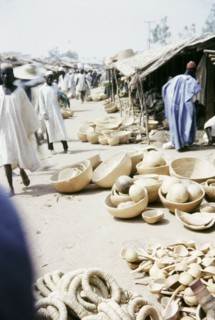 Gourd merchants, Kano. Traders sell a variety of gourd containers from stalls at a busy marketplace