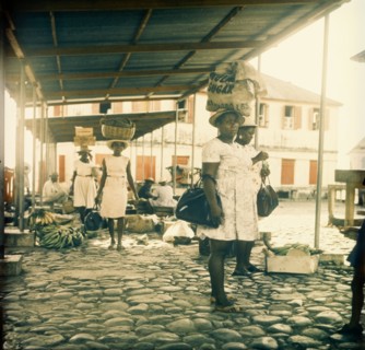 Dominican women at a street market. Dominican women at a street market carry their shopping in