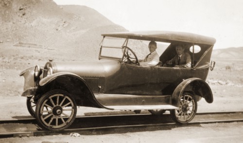 A car modified for rail, Peru. Jack Cooper drives a motor car that has been modified to travel on