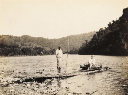 Rafting on the Rio Grande, Jamaica. A European man is ferried across the Rio Grande aboard a raft