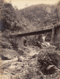 Road bridge across the Hope River. The Hope River runs belows a road bridge in the mountains. St