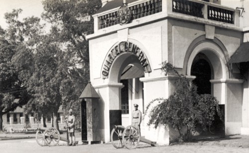 General Barracks at Panjim. Armed guards stand beside mounted artillery guns outside a 'Quartel