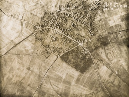 Aerial view of a bomb-damaged village. One of a series of British aerial reconnaissance photographs