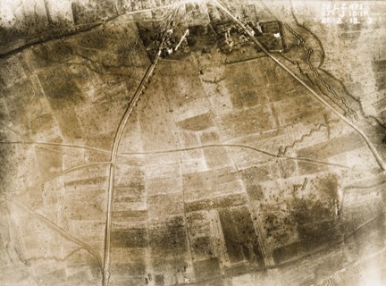 Aerial view of a bomb-damaged village. One of a series of British aerial reconnaissance photographs