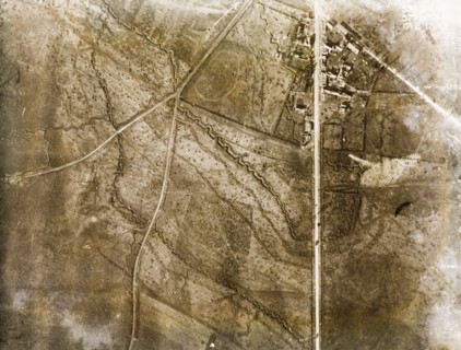 Trenches surround a bomb-damaged village. One of a series of British aerial reconnaissance