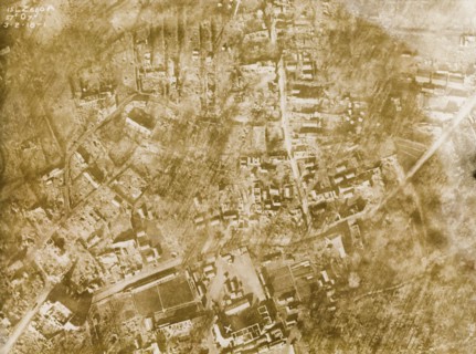 Aerial view of a bomb-damaged village. One of a series of British aerial reconnaissance photographs