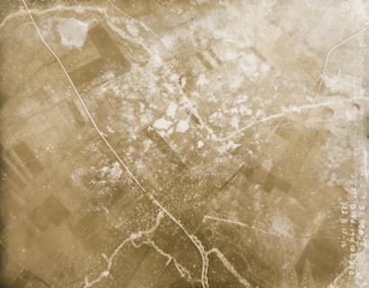 Fields riddled with trenches and bomb craters. One of a series of British aerial reconnaissance