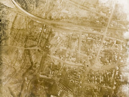 Aerial view of a bomb-damaged village. One of a series of British aerial reconnaissance photographs