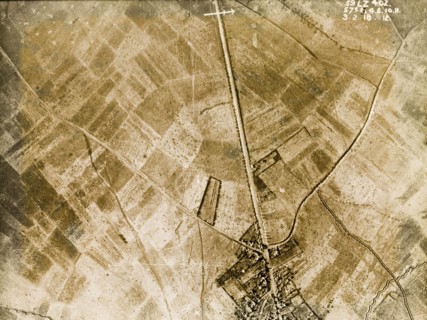 Aerial view of a bomb-damaged village. One of a series of British aerial reconnaissance photographs