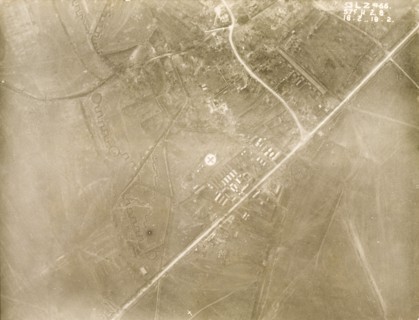 A military camp at a bomb-damaged village. One of a series of British aerial reconnaissance