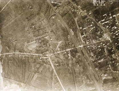 Aerial view of a bomb-damaged village. One of a series of British aerial reconnaissance photographs