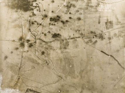 Shell blasts in the snow. One of a series of British aerial reconnaissance photographs recording