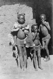 Three African boys. Three young boys, possibly members of a Bantu-speaking tribe, pose for the