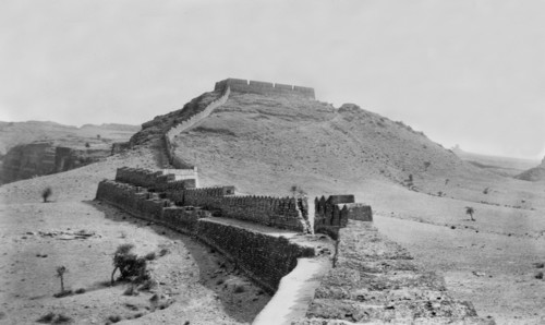 Fort wall in Kohistan . The defensive outer wall of a hill fort runs along the peak of a hill in