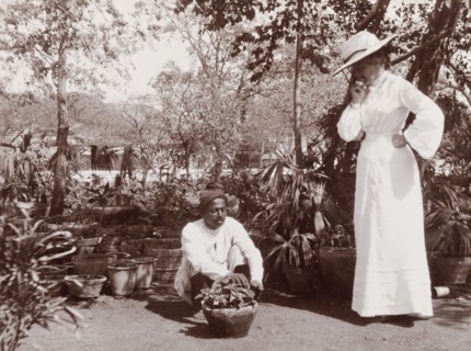 Phyllis Lawrence watches a gardener at work. Phyllis Louise Lawrence, the first wife of Sir Henry