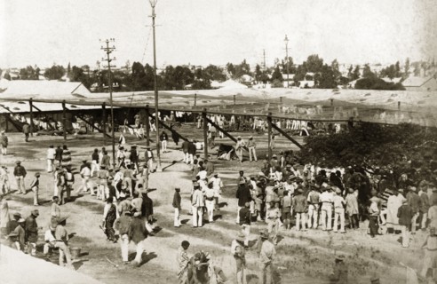 The market place in Kimberley. African diamond mine workers gather in the market place at Kimberley