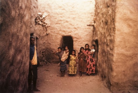 A group of children in Yemen. A group of children pose for the camera in an alcove formed by