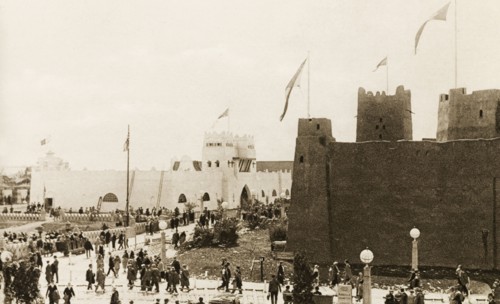 British Empire Exhibition at Wembley. Crowds visit replicas of buildings from the Gold Coast
