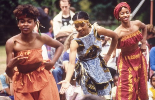 Dancers at the West African Music Village. Female dancers in traditional African dress perform at
