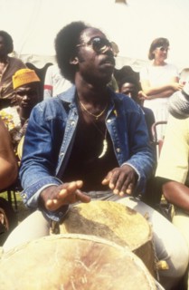 Drummer at the West African Music Village. A musician plays the drums at the West African Music