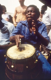 Drummer at the West African Music Village. A musician plays the drums at the West African Music