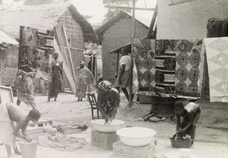 Washing day at an Asante village. Women and children wash clothes outdoors at an Asante (Ashanti)
