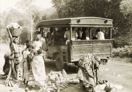 Taxi in the Gold Coast. Plantain sellers and other passengers arrange their loads by the roadside