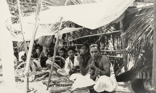Craft stall at a Fijian market. Fijian craftsmen sit in the shade of canopies as their sell their