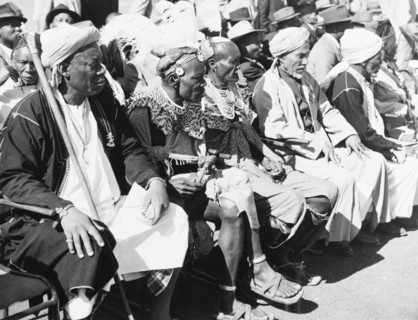 Awaiting the arrival of Princess Elizabeth. An assembly of African chiefs in ceremonial dress sit