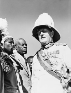 Sir Phillip Mitchell greets African chiefs. Sir Phillip Mitchell (1890-1964), the Governor of
