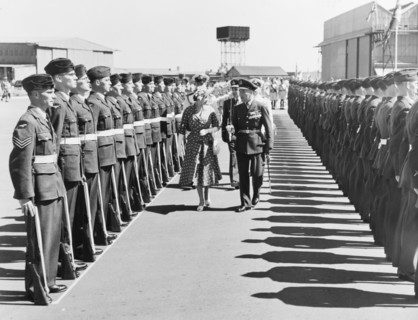 Princess Elizabeth inspects a Guard of Honour. Princess Elizabeth is accompanied by a British
