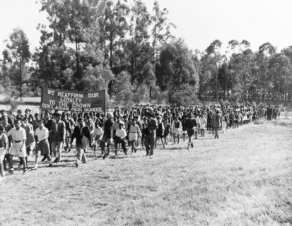 Asian students arrive at Government House. A long line of Asian high school students arrive at