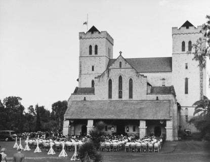 Memorial service for King George VI, Nairobi. A congregation of mourners sit on chairs with their