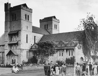 Memorial service for King George VI, Nairobi. A congregation of mourners sit on chairs outside All