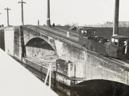 Mole on Panama Canal. A railcar runs along the top of a stone mole by the Panama Canal. Panama,