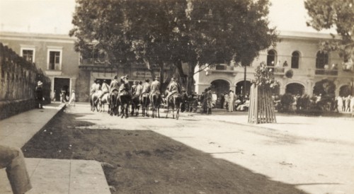 Rurales in Santo Domingo. A band of 'rurales' (Mexican rural guards) ride on horseback through a