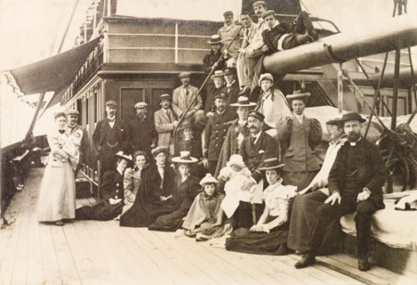 Passengers and crew of S.S. Edinburgh. The Captain of S.S. Edinburgh holds baby Jess Murray on his