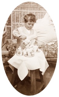 James Murray playing with a tea set. Four year old James Murray playing with a tea set during a