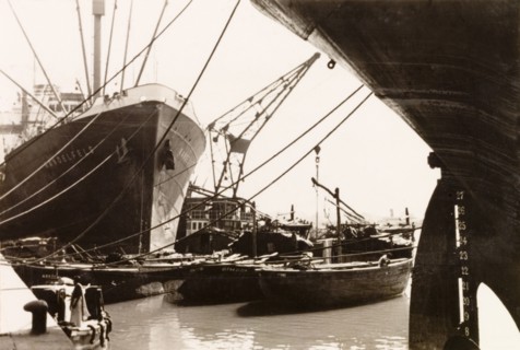 The docks at Calcutta. View of ships and boats moored at the docks in Calcutta. Calcutta (Kolkata),