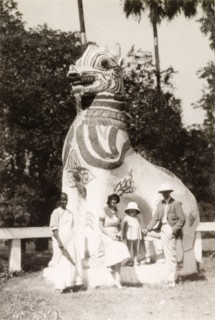 Sightseeing at the Shwe Dagon Pagoda. British tourists, accompanied by an Indian ayah (nursemaid),
