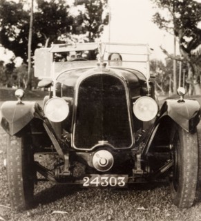 Posing in a Avion Voisin car, Calcutta. British colonist Noel Stokes sits in his Avion Voisin car