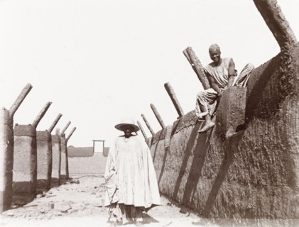 Emir's agent visits the site of a new school. A Nigerian man identified as 'Daudu, one of the Emir