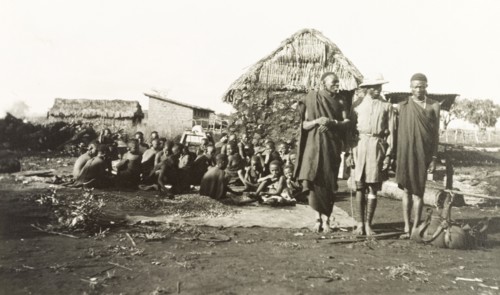 The Mission Boy'. A young African missionary, dressed in Western-style clothing and a solatopi hat,