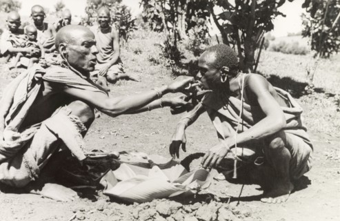 Kikuyu purification ceremony. A Kikuyu witch doctor performs a traditional purification ceremony to