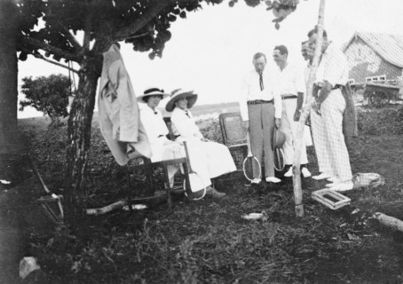 Tennis party at Kitimura Estate. Six European friends gather for a game of tennis at Kitimura