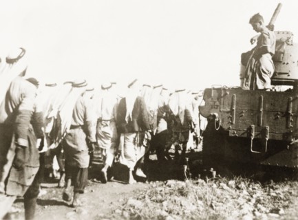 Marching Palestinian Arabs to a detention centre. British soldiers march a group of Palestinian