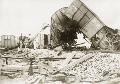 Derailed freight cars at Lydda. Several freight cars lie in a tangled heap, derailed in a sabotage