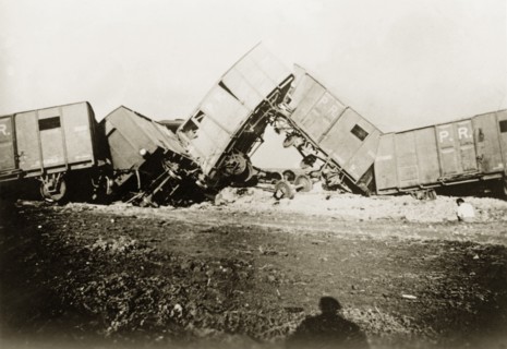 Derailed freight cars at Lydda. Several freight cars lie in a tangled heap, derailed in a sabotage
