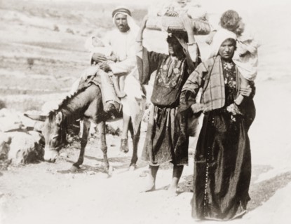 Arab family on a rural road. An Arab family travel along a rural road with two sleeping children.