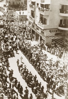 Funeral procession in Tel Aviv. A military escort accompanies a funeral procession during the Great